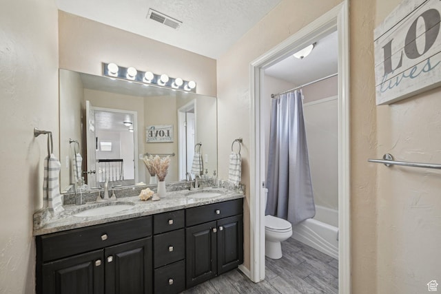 11732 S Lampton View Dr W, South Jordan, UT 84095 - bathroom featuring toilet, double vanity, wood finished floors, and shower / bath combo with shower curtain