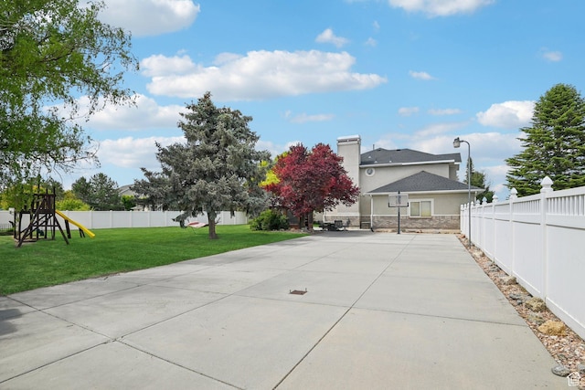 11732 S Lampton View Dr W, South Jordan, UT 84095 - rear view of property featuring a playground, a chimney, and stucco siding