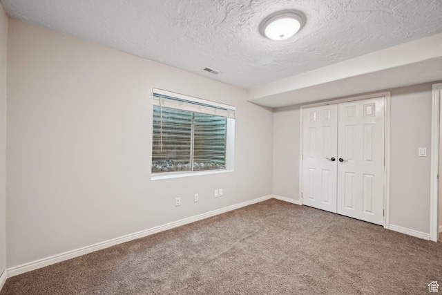11732 S Lampton View Dr W, South Jordan, UT 84095 - unfurnished bedroom featuring carpet, a textured ceiling, baseboards, and a closet