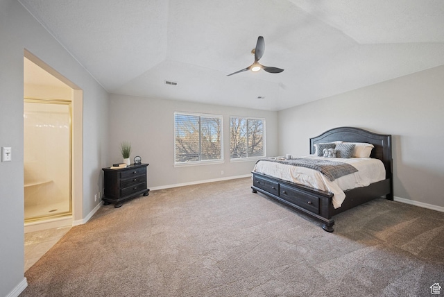 bedroom with visible vents, baseboards, lofted ceiling, and carpet