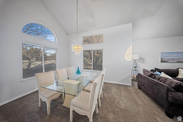 dining space with a notable chandelier, baseboards, carpet, and high vaulted ceiling