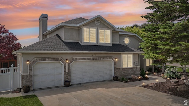 11732 S Lampton View Dr W, South Jordan, UT 84095 - traditional-style home with stucco siding, driveway, a shingled roof, a chimney, and stone siding