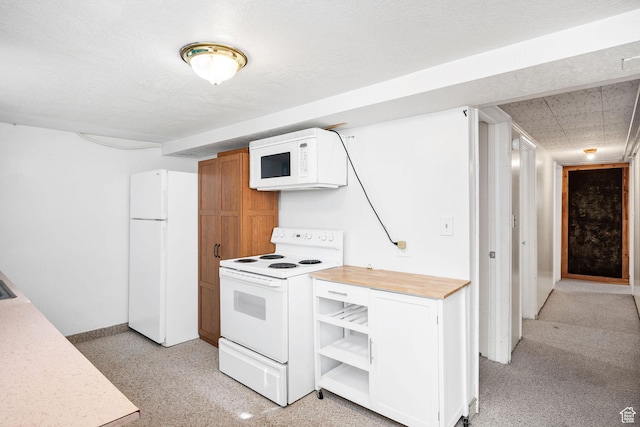 423 N 200 E, Tremonton, UT 84337 - kitchen featuring white appliances, open shelves, baseboards, and white cabinetry