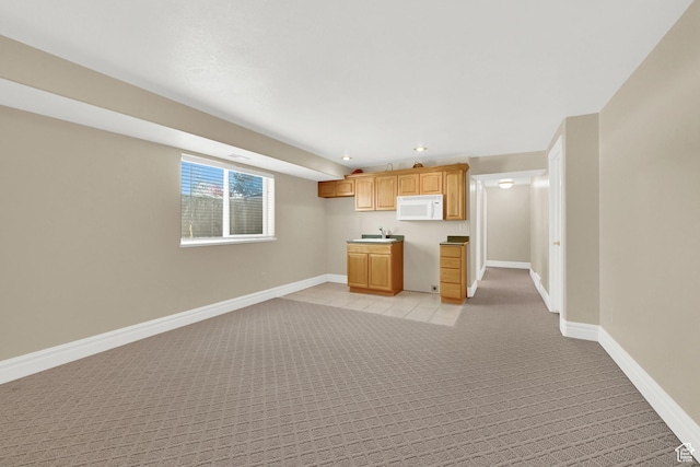 338 N 1090 W, Hyrum, UT 84319 - kitchen with white microwave, light carpet, baseboards, recessed lighting, and open floor plan
