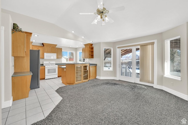 338 N 1090 W, Hyrum, UT 84319 - kitchen featuring white appliances, open shelves, lofted ceiling, ceiling fan, and baseboards