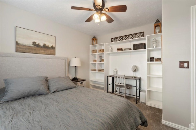 bedroom featuring carpet, a textured ceiling, baseboards, and a ceiling fan