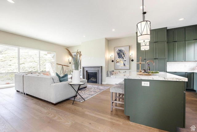 386 W Ascent Dr Unit 257, Hideout, UT 84036 - living room with recessed lighting, a fireplace, and wood finished floors