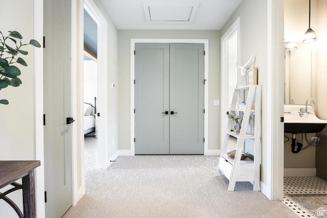 386 W Ascent Dr Unit 257, Hideout, UT 84036 - mudroom with carpet floors, a sink, attic access, and baseboards