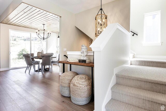 386 W Ascent Dr Unit 257, Hideout, UT 84036 - stairs with a chandelier, baseboards, and hardwood / wood-style flooring