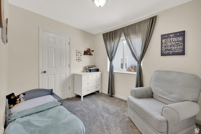 bedroom featuring carpet flooring and baseboards