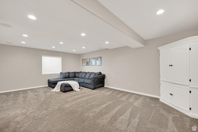 unfurnished living room with baseboards, recessed lighting, and light carpet