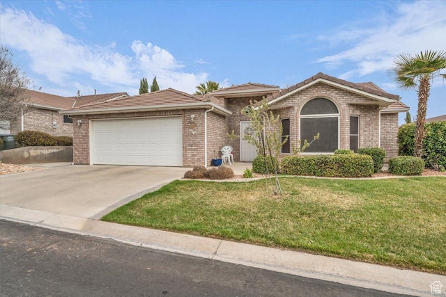 ranch-style house featuring a garage, a front yard, driveway, and a tiled roof