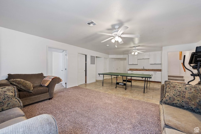 155 W 960 S, Hurricane, UT 84737 - living area with light colored carpet, a ceiling fan, visible vents, and stairs