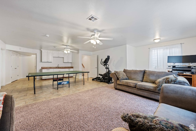155 W 960 S, Hurricane, UT 84737 - living room featuring visible vents, a ceiling fan, and light colored carpet
