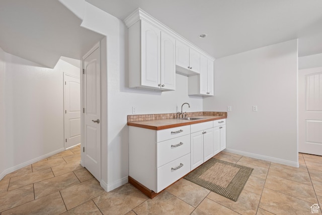 155 W 960 S, Hurricane, UT 84737 - kitchen with a sink, light countertops, white cabinets, and baseboards