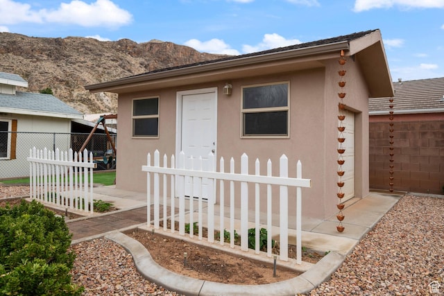 155 W 960 S, Hurricane, UT 84737 - view of front of property with a mountain view, fence, and stucco siding
