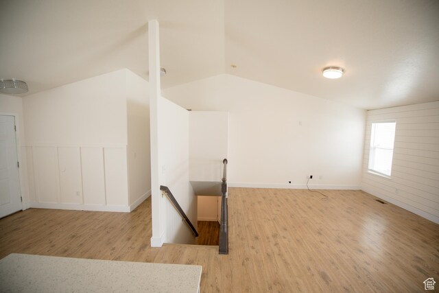 interior space with vaulted ceiling and wood finished floors