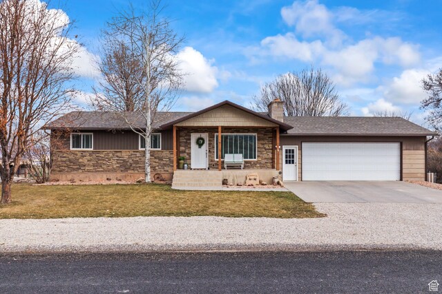 79 S 250 E, Aurora, UT 84620 - single story home featuring an attached garage, stone siding, driveway, a chimney, and a front yard