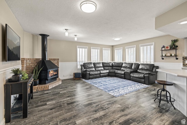 79 S 250 E, Aurora, UT 84620 - living room featuring a wainscoted wall, a textured ceiling, and wood finished floors