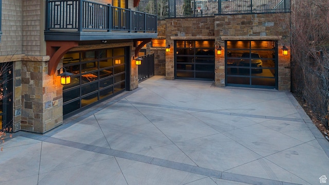 exterior space with a balcony and a garage