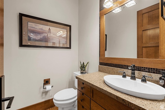 half bath with vanity and toilet
