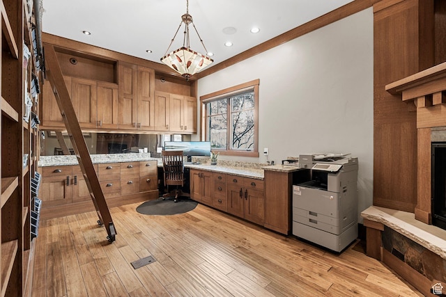 office with recessed lighting and light wood-style floors