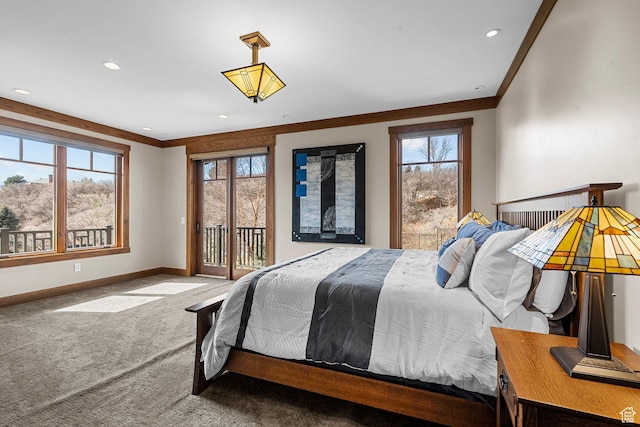 carpeted bedroom with access to exterior, multiple windows, and ornamental molding