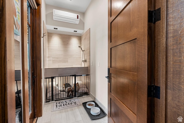 hall featuring a wall mounted AC
