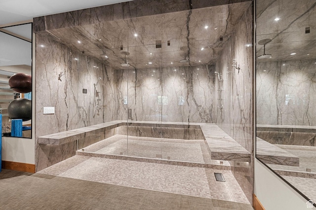 full bath with a marble finish shower