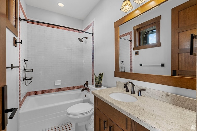 bathroom with shower / bath combination, toilet, and vanity