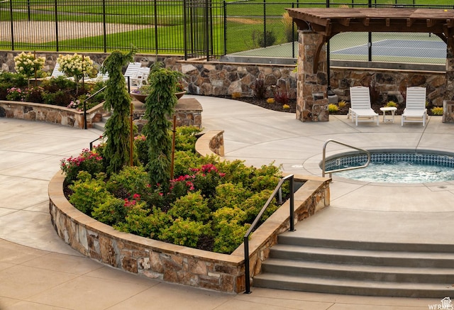 view of pool with a patio and fence