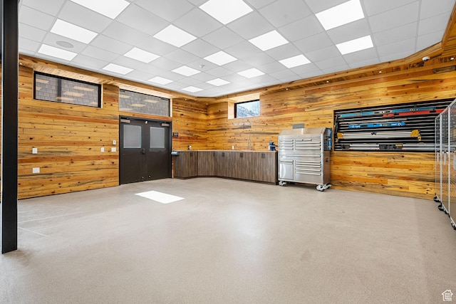 spare room with wood walls