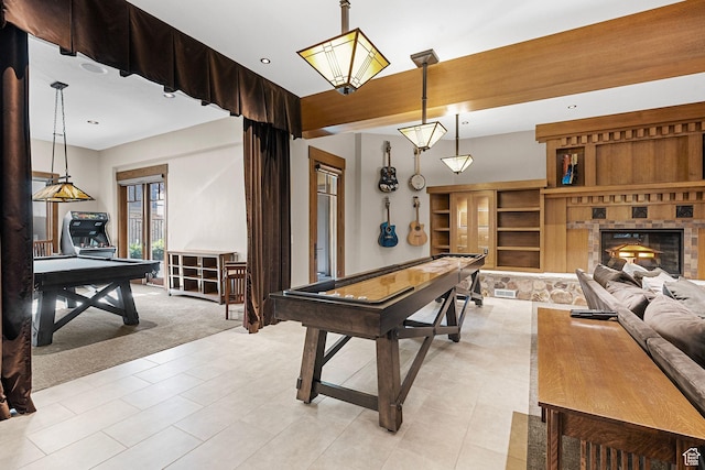 playroom with a glass covered fireplace, recessed lighting, and visible vents