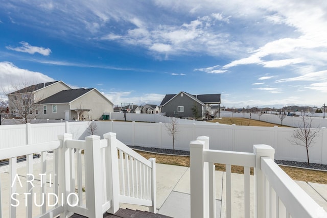 view of yard with a residential view and a fenced backyard