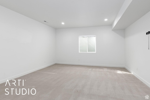 carpeted empty room with visible vents, recessed lighting, and baseboards