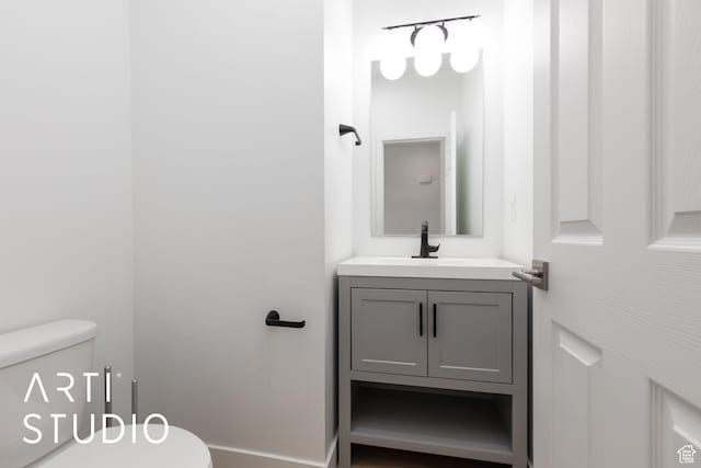 bathroom with vanity and toilet