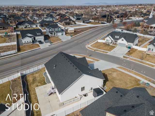 birds eye view of property with a residential view