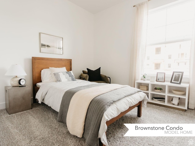 bedroom featuring light colored carpet