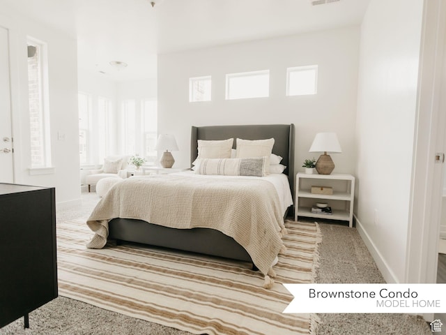bedroom with visible vents and baseboards
