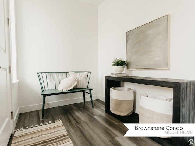 home office with baseboards and wood finished floors