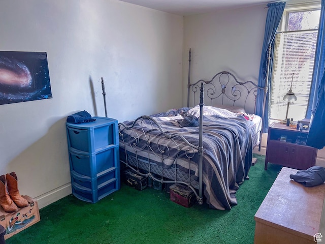 carpeted bedroom featuring multiple windows
