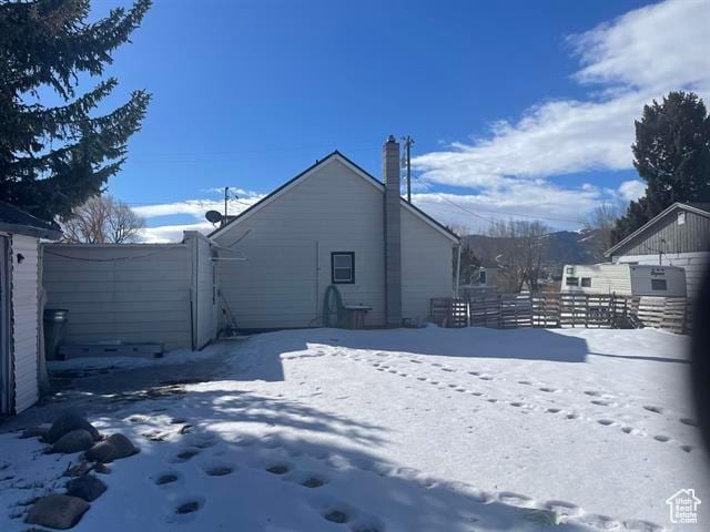 161 E 4th S, Soda Springs, ID 83276 - view of snowy exterior with fence