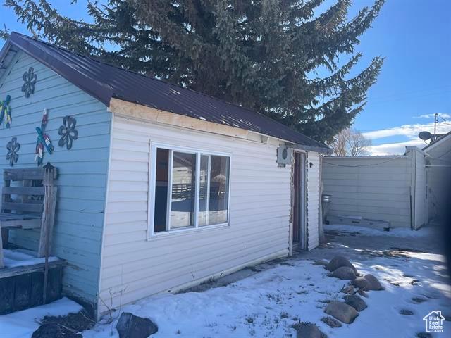 161 E 4th S, Soda Springs, ID 83276 - view of snow covered exterior with fence