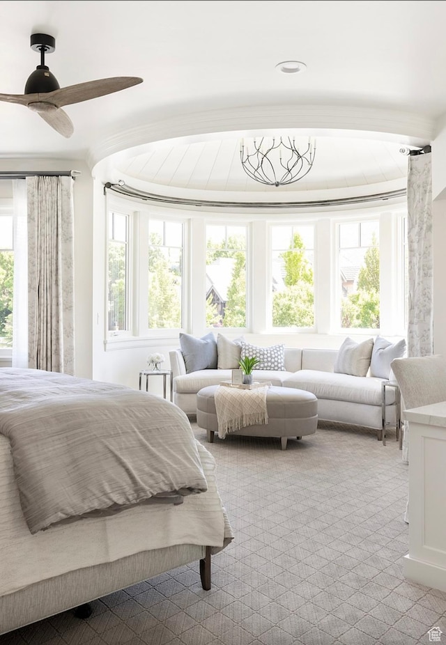 bedroom with carpet floors and multiple windows