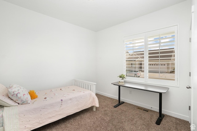 bedroom with carpet, visible vents, and baseboards