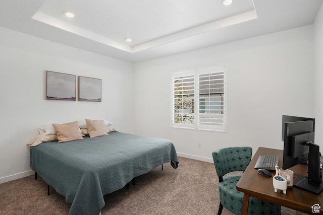 bedroom with carpet floors, a tray ceiling, recessed lighting, and baseboards