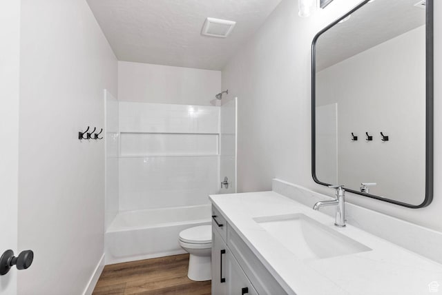 4068 Porter Ave, South Ogden, UT 84403 - bathroom featuring wood finished floors, vanity, toilet, bathtub / shower combination, and baseboards