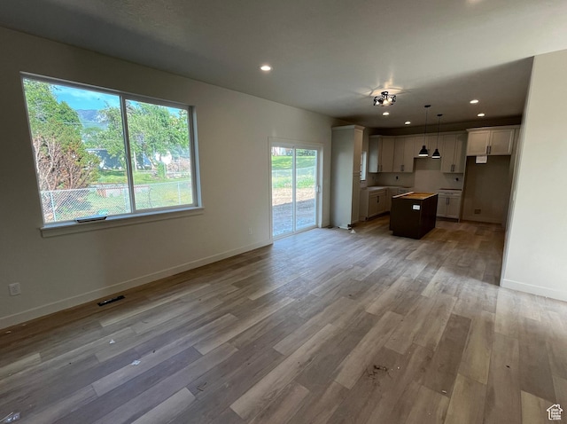 4068 Porter Ave, South Ogden, UT 84403 - unfurnished living room featuring light wood-style flooring, baseboards, and recessed lighting