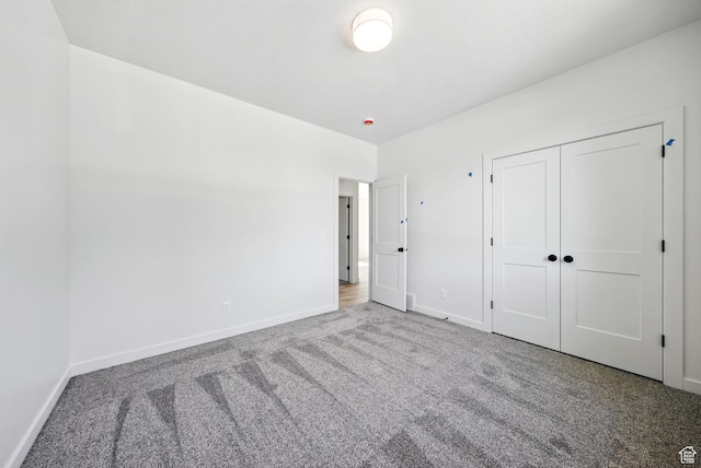 4068 S Porter Ave, South Ogden, UT 84403 - unfurnished bedroom featuring carpet floors and a closet