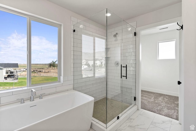 4068 Porter Ave, South Ogden, UT 84403 - full bathroom with marble finish flooring, a soaking tub, a stall shower, and baseboards